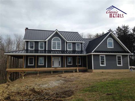 gray house with black metal roof|gray siding black windows.